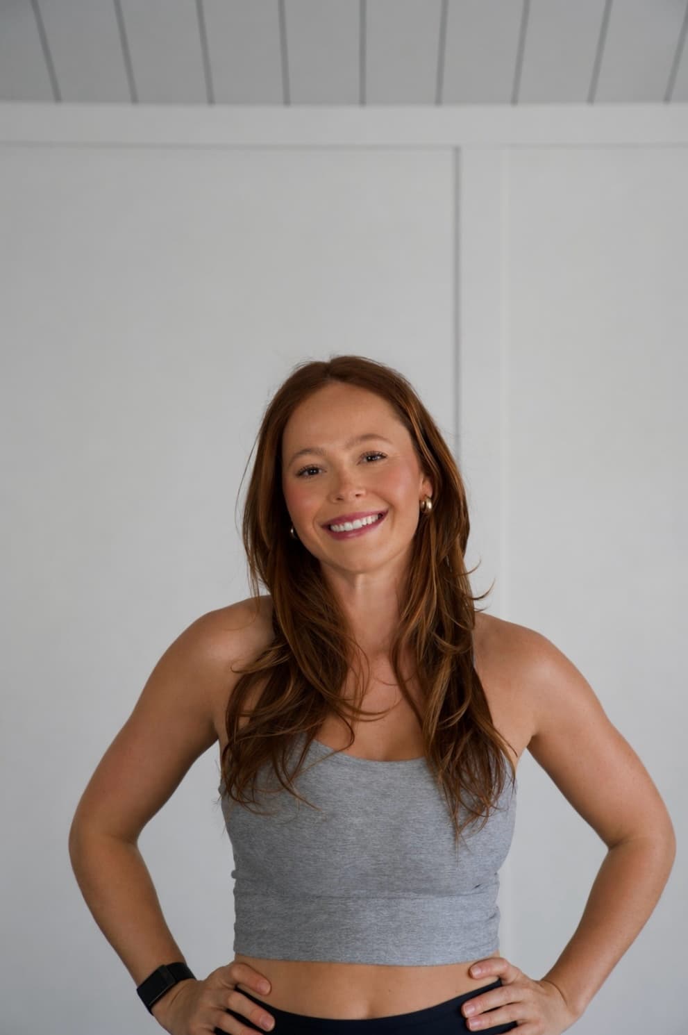 Nicolette smiling in her private training studio.