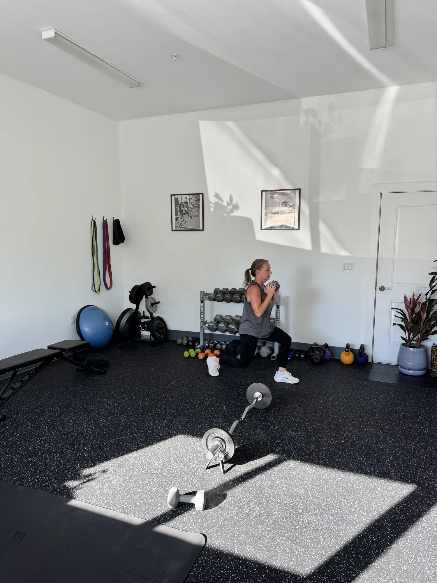 Nicolette in a deep lunge inside the new studio.